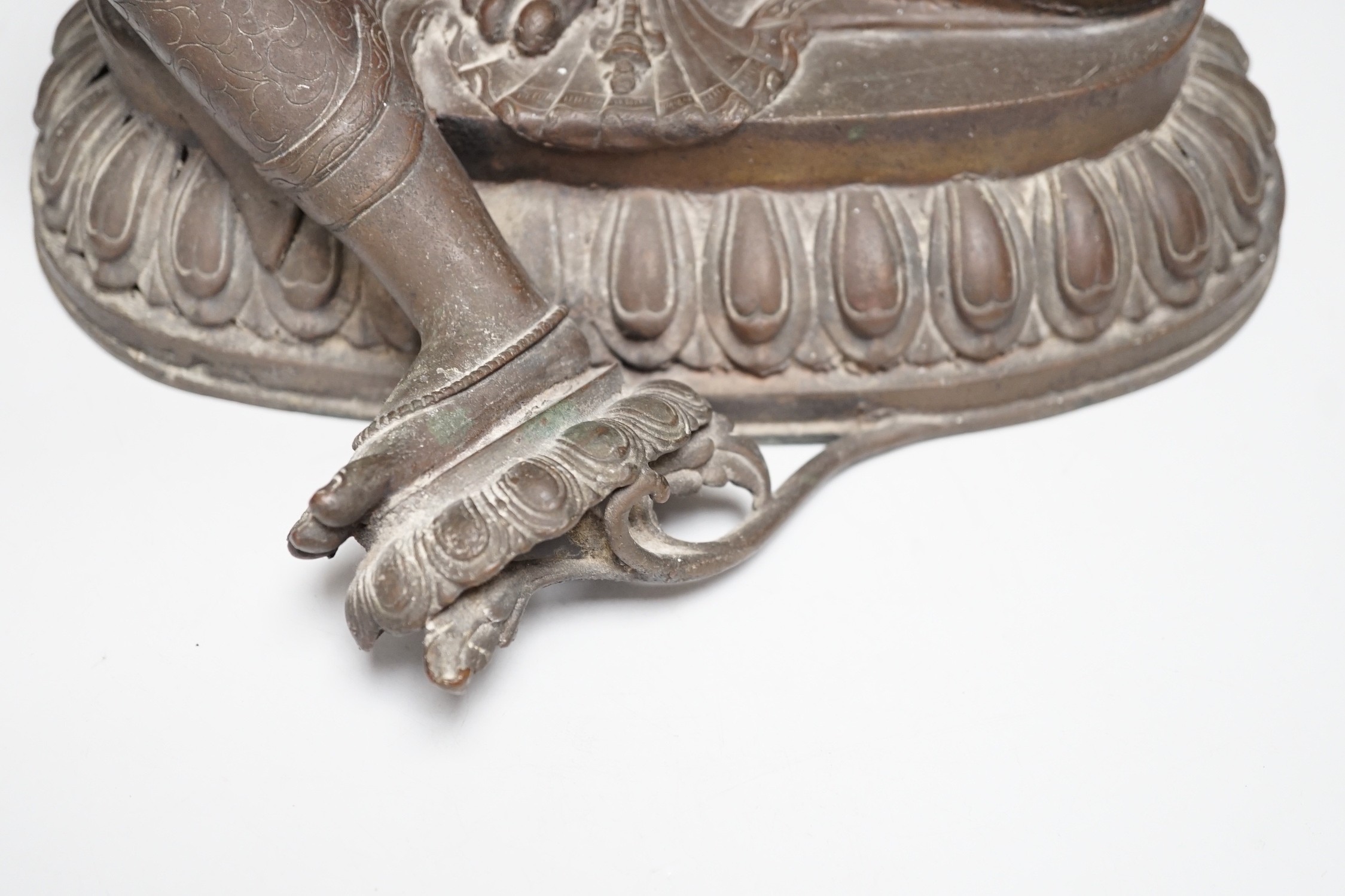 A Buddhist bronze seated figure of Green Tara. 42cm tall